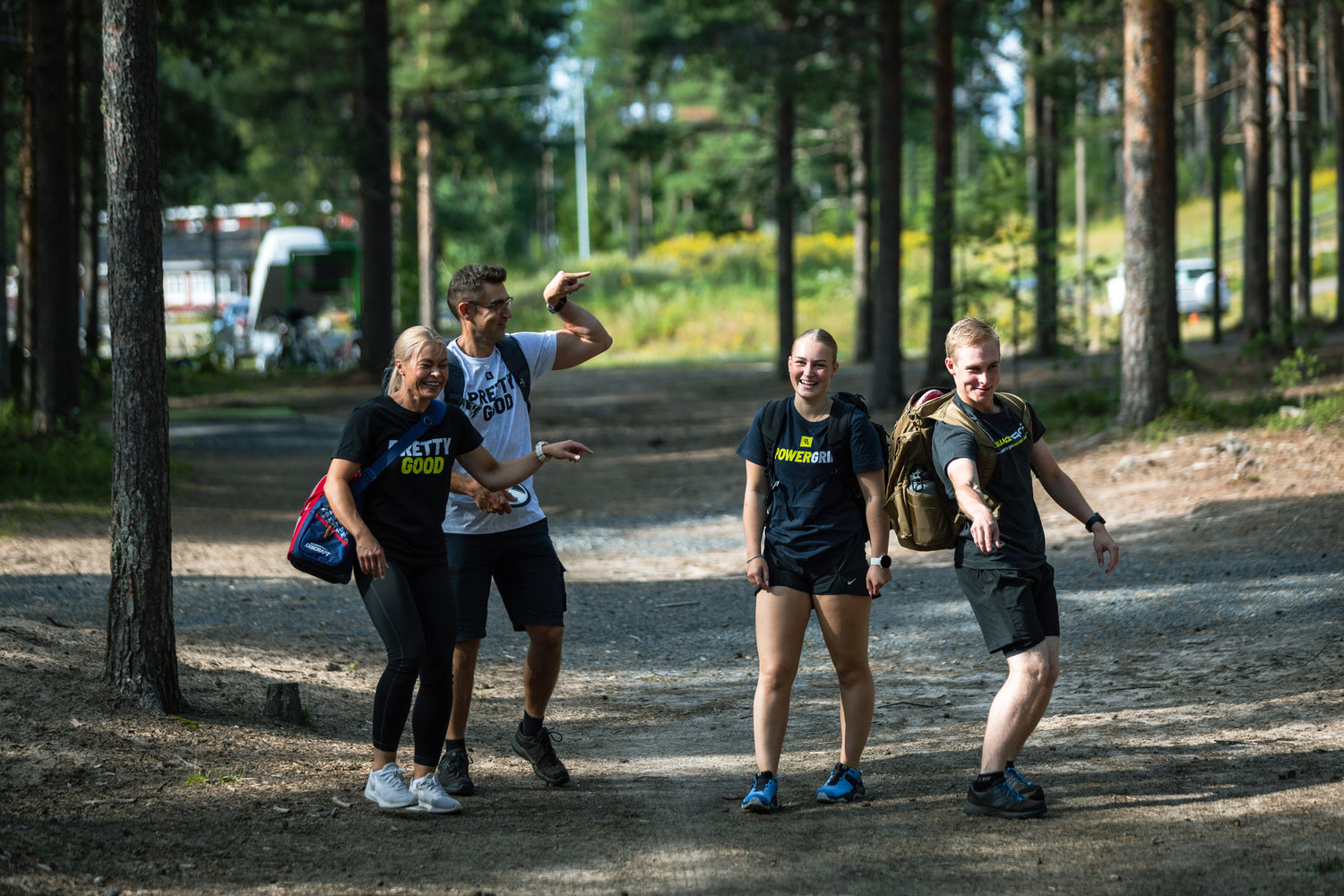 Group of friends playing disc golf in the woods