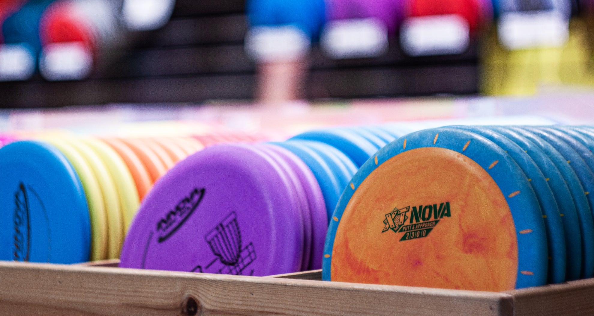 Racks of disc golf discs from Innova