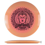 Orange disc golf disc with Buddha graphic.