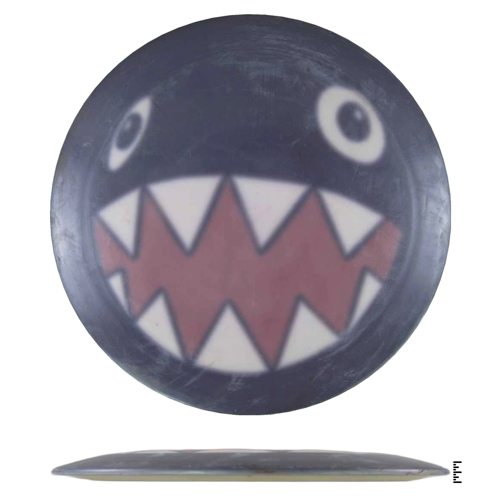 Disc golf disc with Chain Chomp design